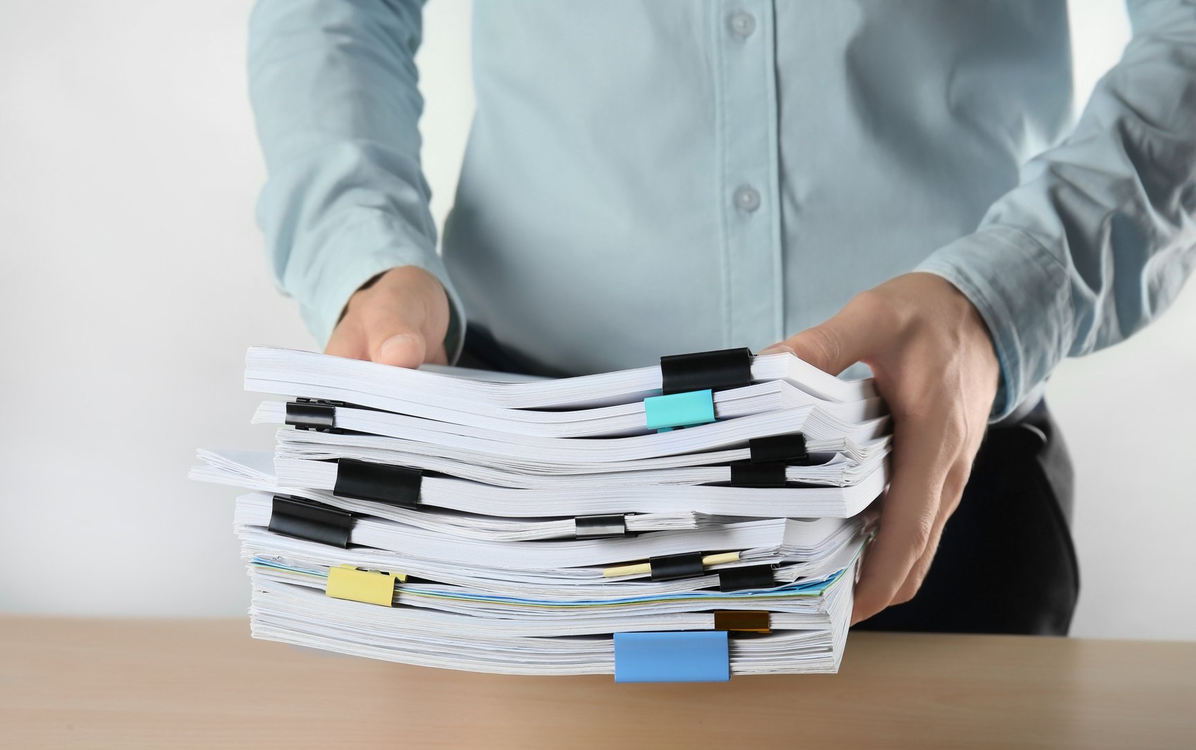 Man with Stack of Documents